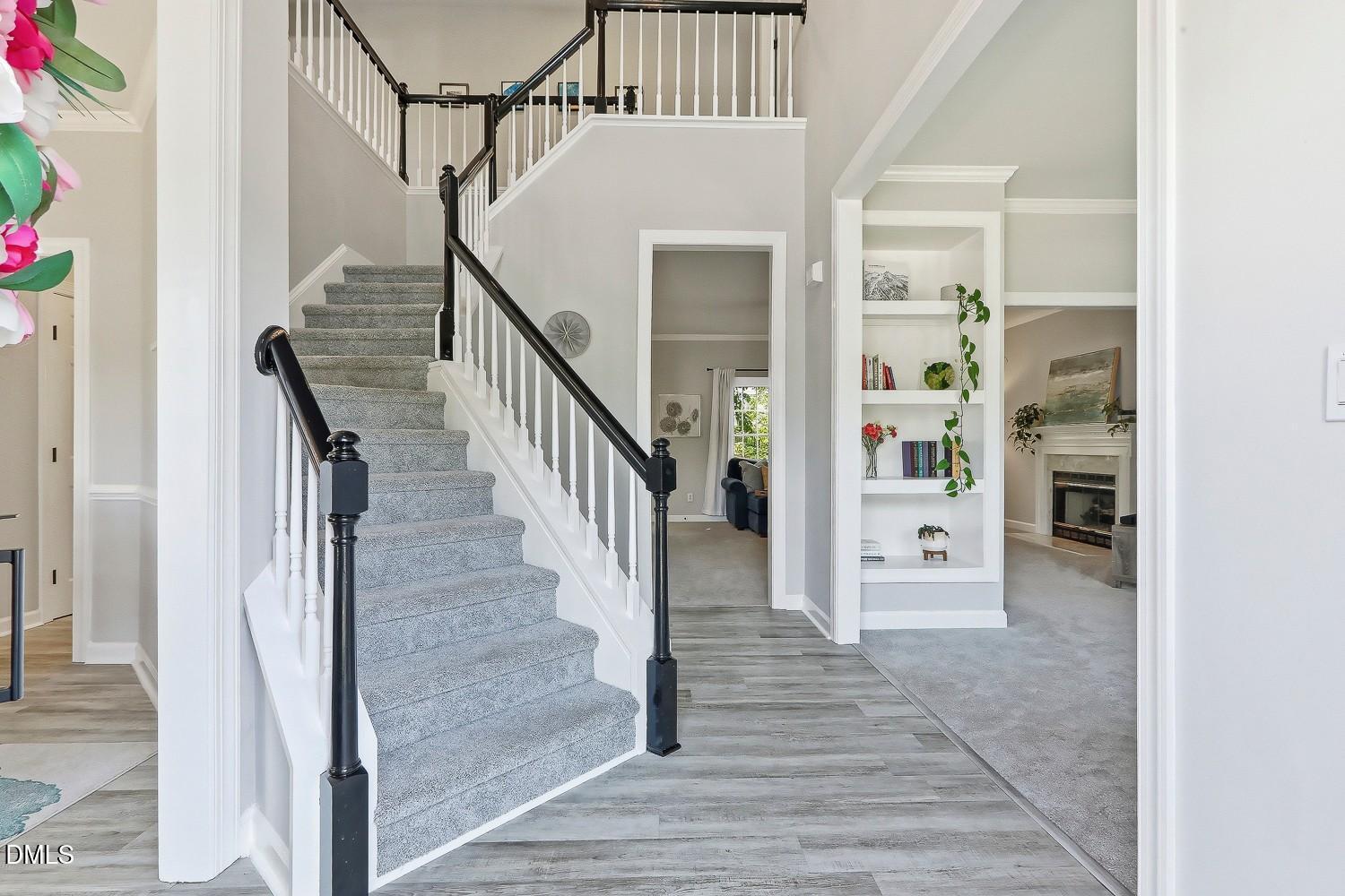 4001 Batiste Road Raleigh, NC 27613 - Photo 5 of 63 a view of entryway and hall with wooden floor