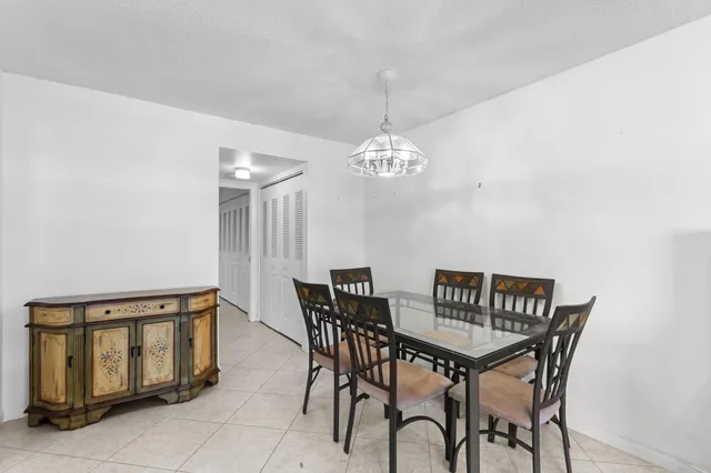 a kitchen with stainless steel appliances white cabinets and a refrigerator