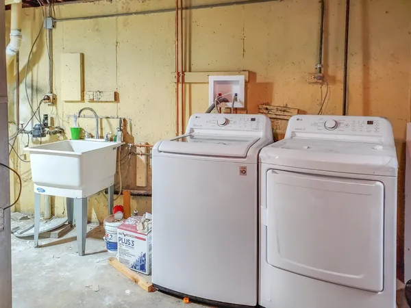 a utility room with dryer and washer
