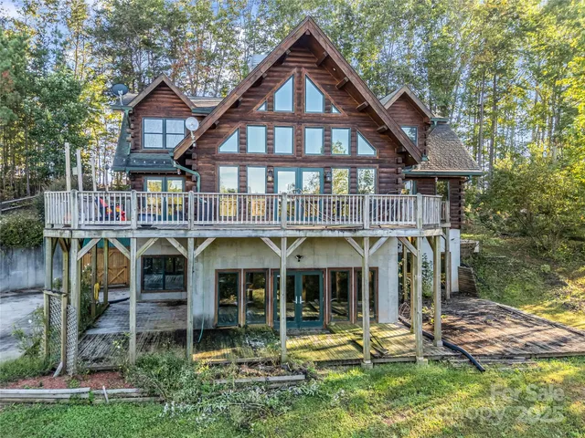 a front view of a house with a yard table and chairs