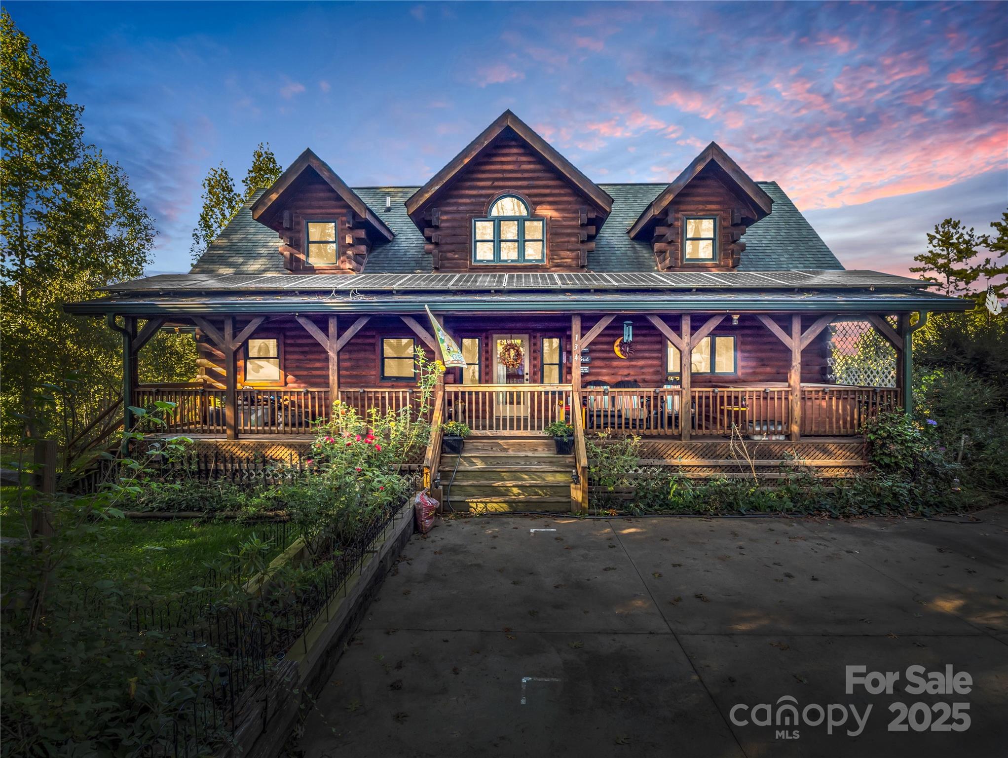 134 Moriah Drive Rutherfordton, NC 28139 - Photo 2 of 37 a view of a brick house with large windows and a yard