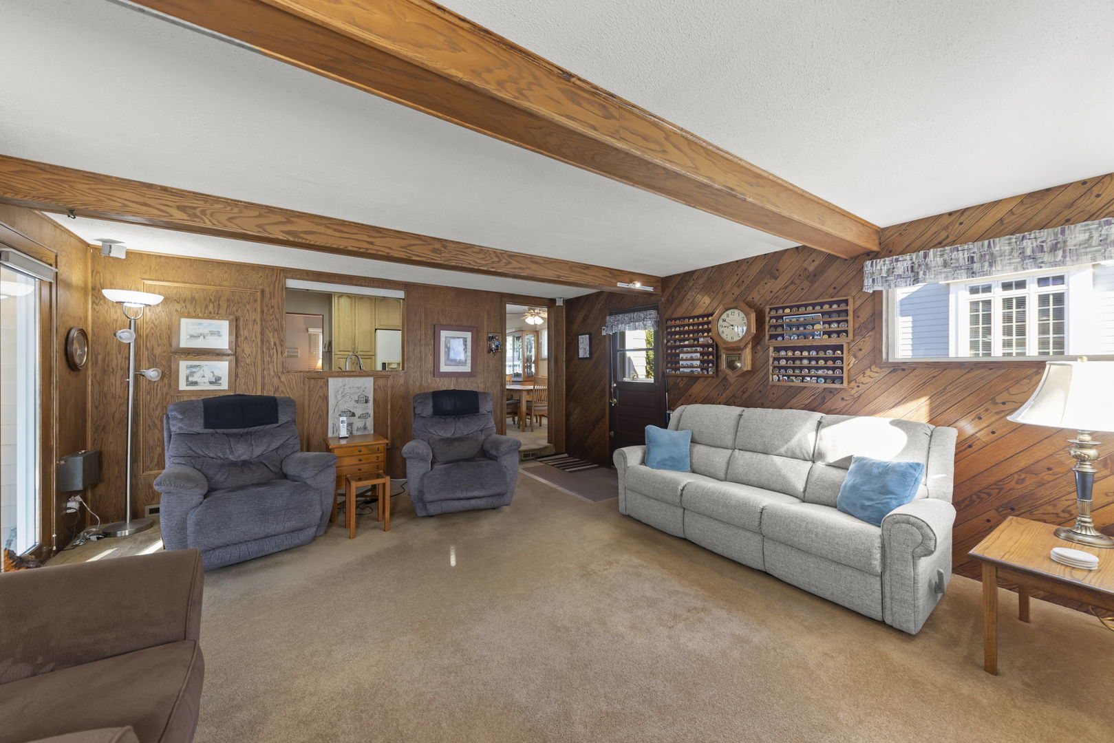 612 Wellner Road Naperville, IL 60540 - Photo 12 of 27 a living room with furniture and a large window