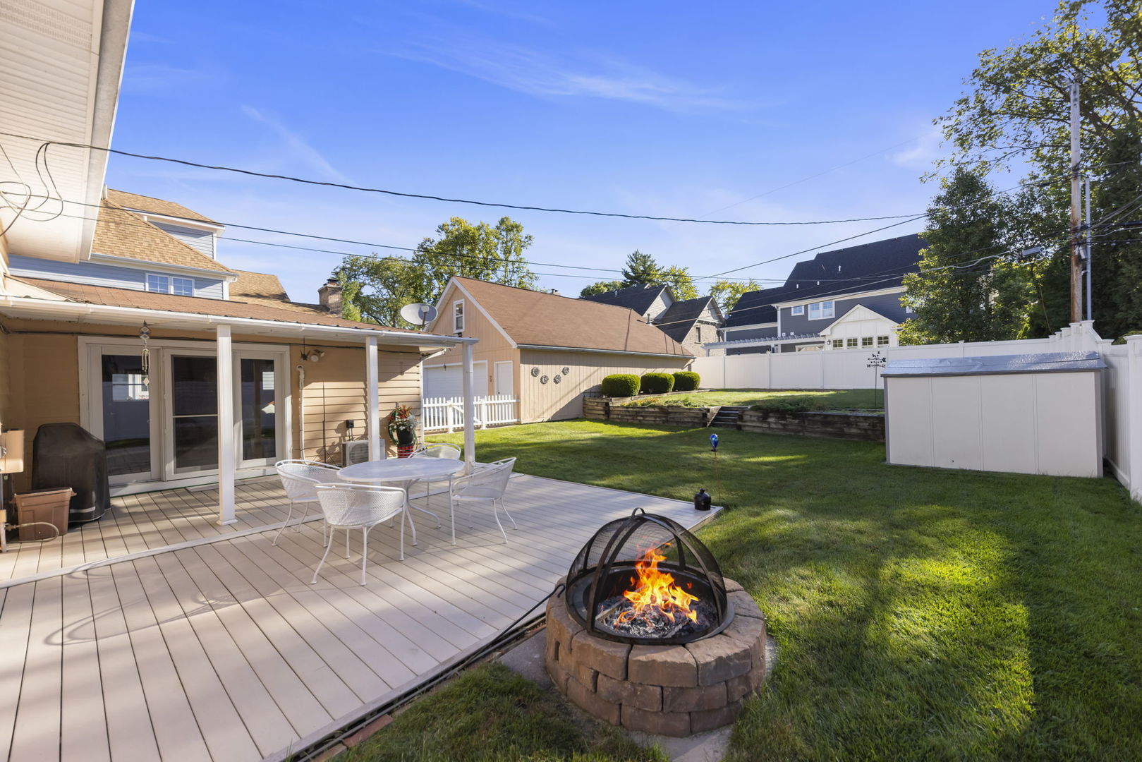 612 Wellner Road Naperville, IL 60540 - Photo 21 of 27 a view of a house with backyard and sitting area