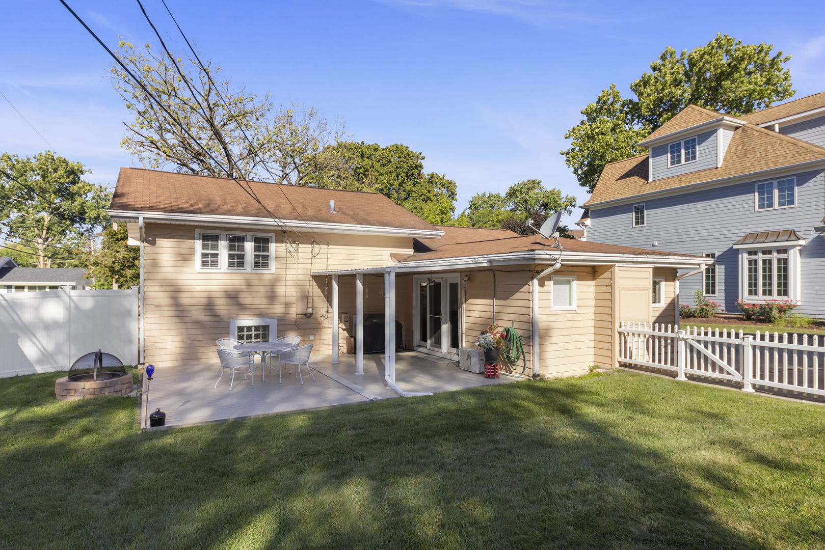 612 Wellner Road Naperville, IL 60540 - Photo 23 of 27 a view of a house with a yard and a garden