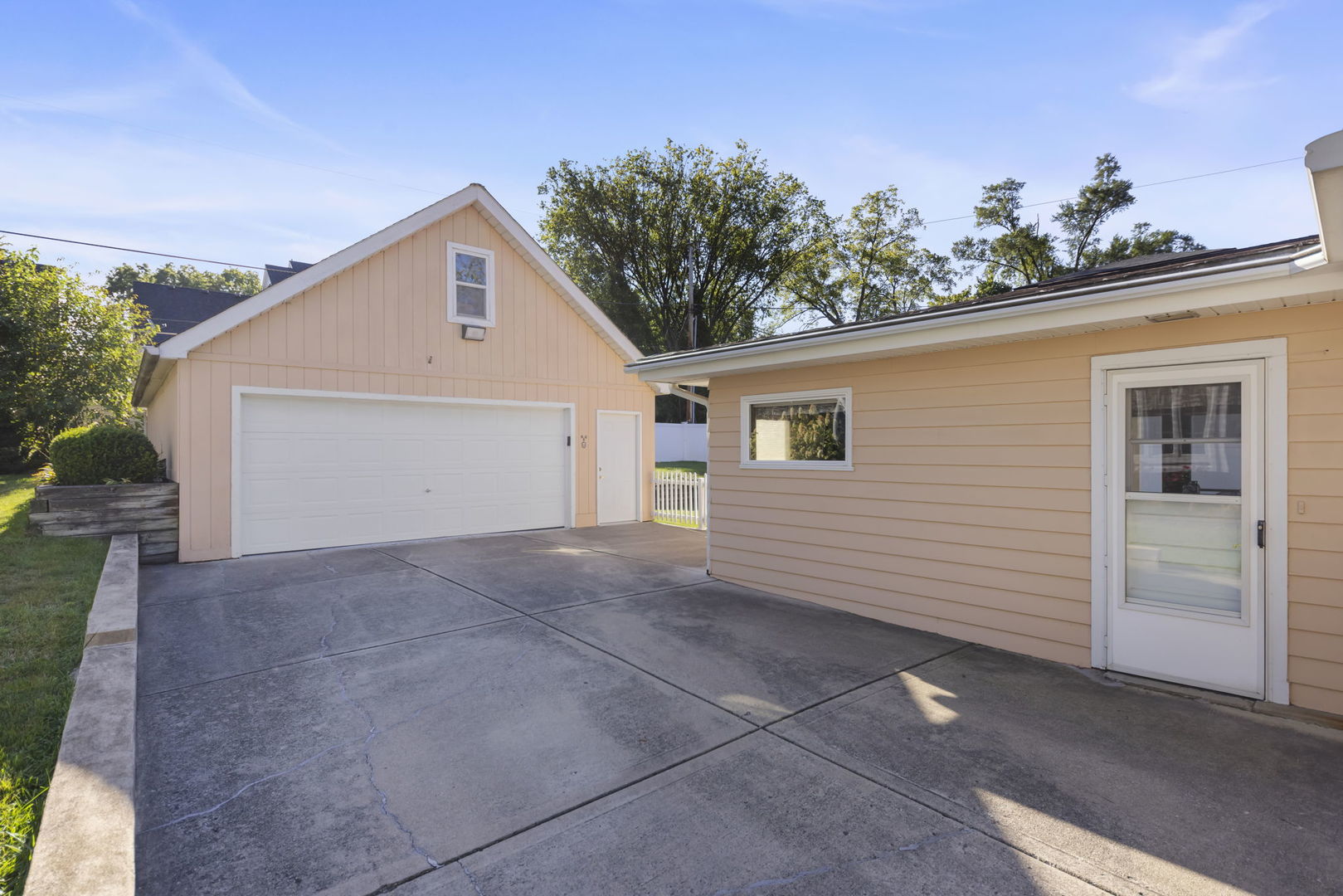 612 Wellner Road Naperville, IL 60540 - Photo 24 of 27 a view of a house with a garage