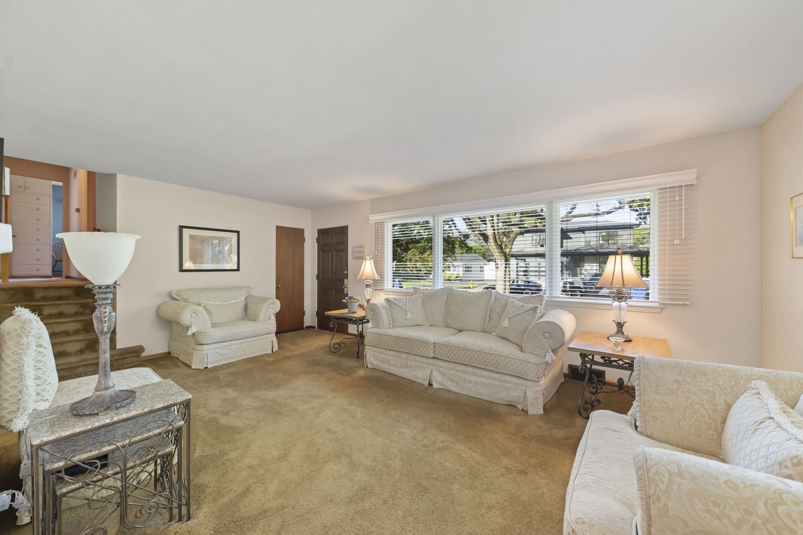 612 Wellner Road Naperville, IL 60540 - Photo 10 of 27 a living room with furniture and a large window