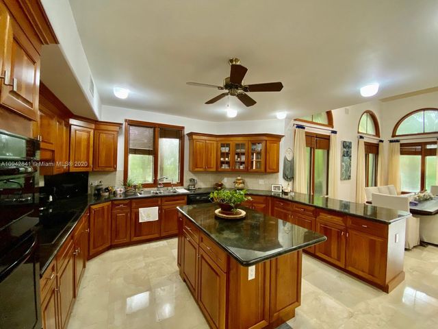 a view of a livingroom with furniture window and wooden floor
