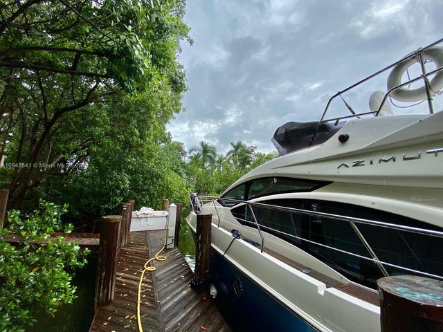 a bathroom with a shower and a mirror