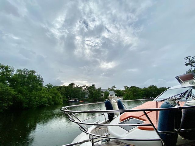 a man sitting on a bench in lobby of a building