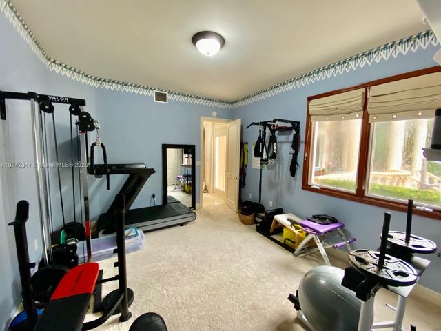 a view of a chairs and table in patio