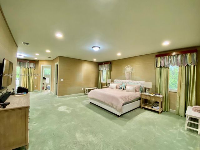 a view of a balcony with yard