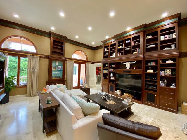 a view of living room kitchen with furniture and floor to ceiling window