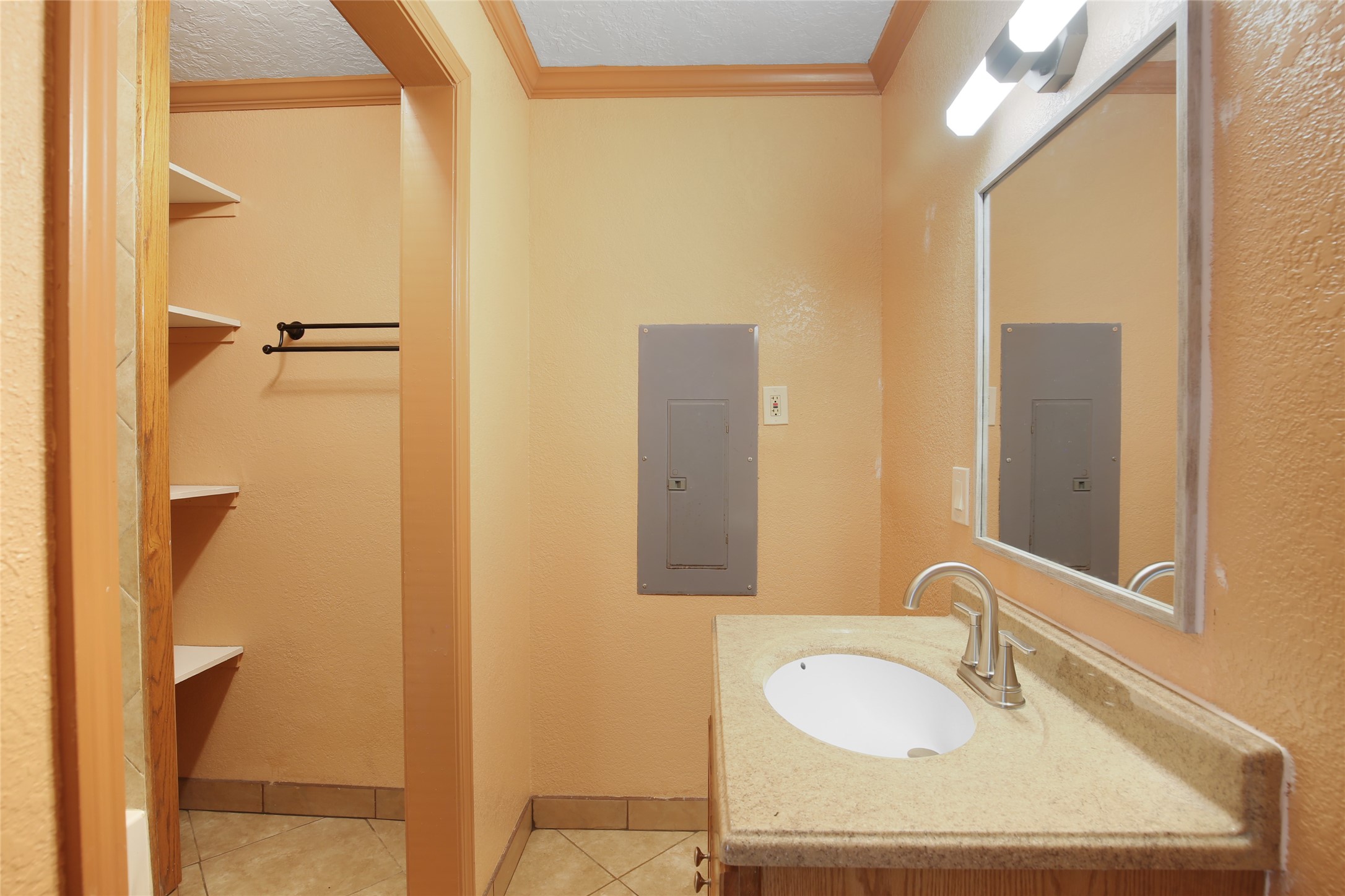 6923 Leader Street Houston, TX 77074 - Photo 17 of 19 a bathroom with a granite countertop sink and a mirror