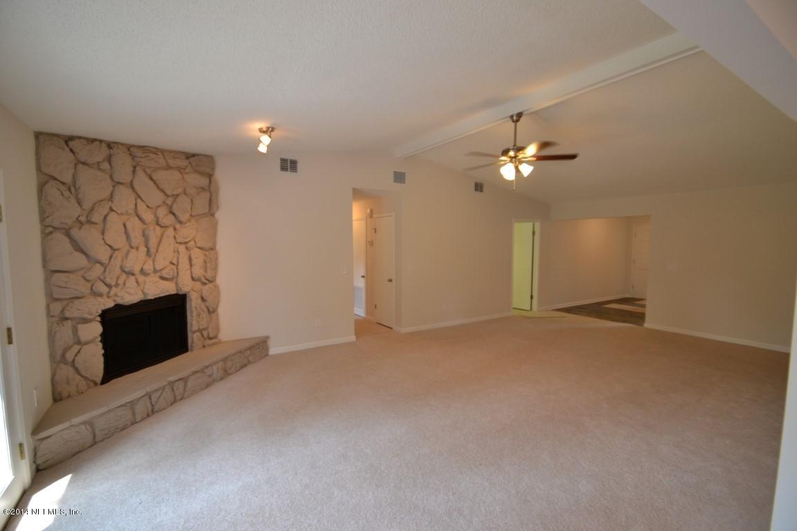 10950 Reading Road Jacksonville, FL 32257 - Photo 21 of 42 a view of an empty room with a fireplace