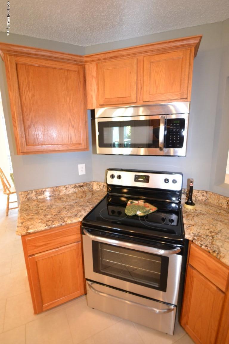 10950 Reading Road Jacksonville, FL 32257 - Photo 33 of 42 a stove top oven sitting next to a window