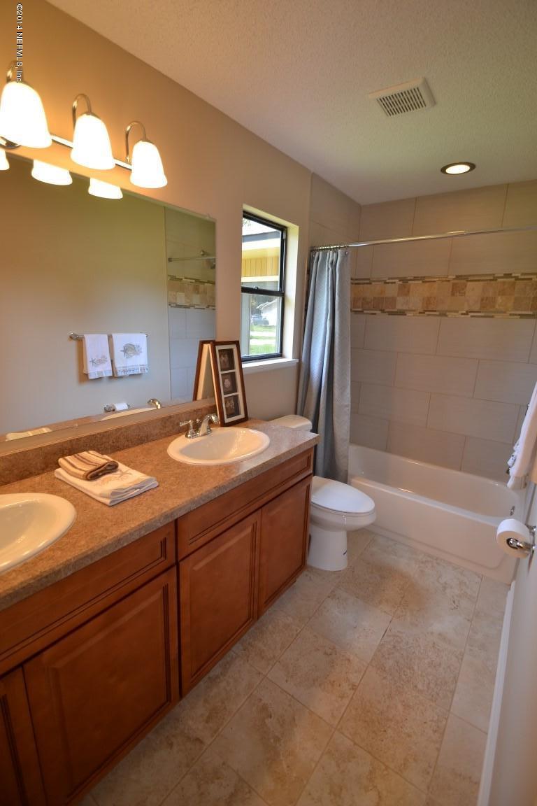 10950 Reading Road Jacksonville, FL 32257 - Photo 8 of 42 a bathroom with a sink a toilet and shower