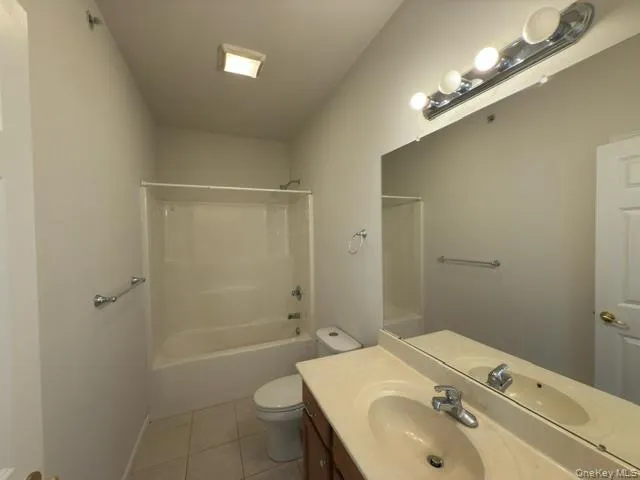 a bathroom with a sink toilet tub and shower