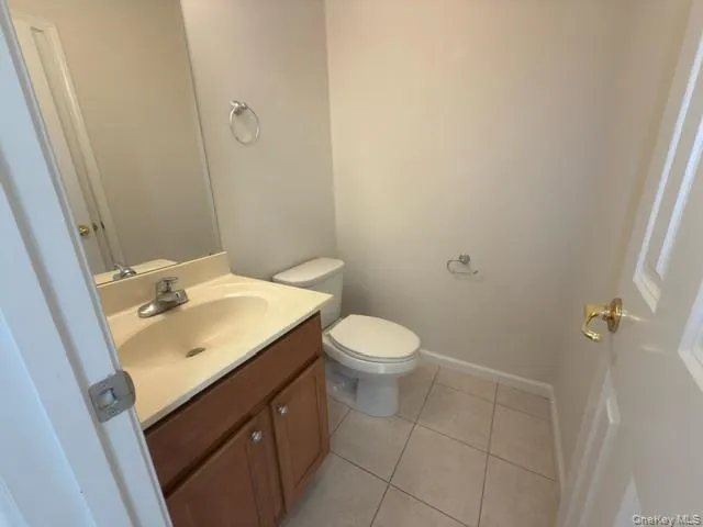 a bathroom with a sink toilet and vanity