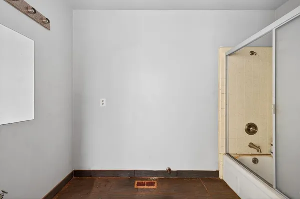 a view of bathroom with a tub shower vanity and a sink