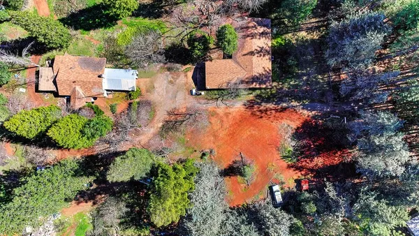 an aerial view of residential house with outdoor space and lake view
