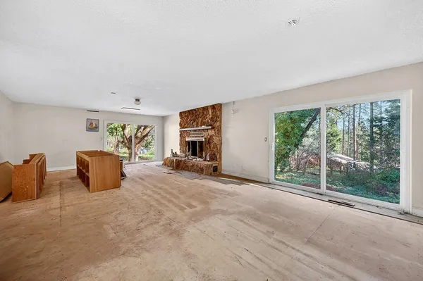 a view of a livingroom with furniture and window