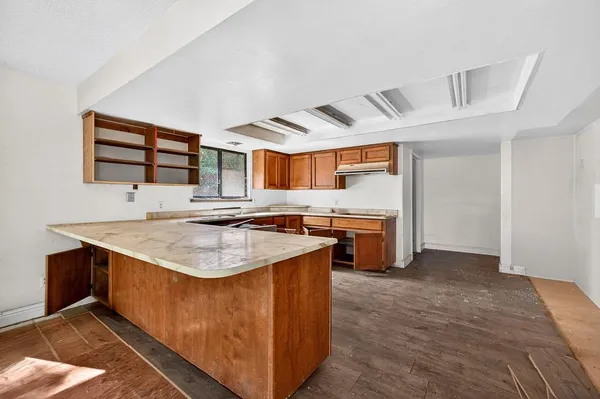 a kitchen with stainless steel appliances granite countertop a stove and a sink