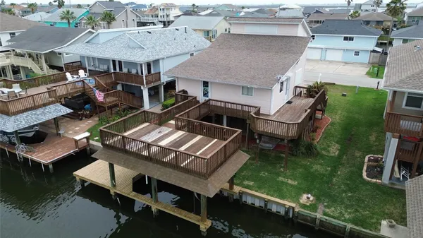 an aerial view of a house with garden space and street view