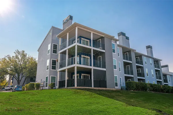 a front view of building with yard