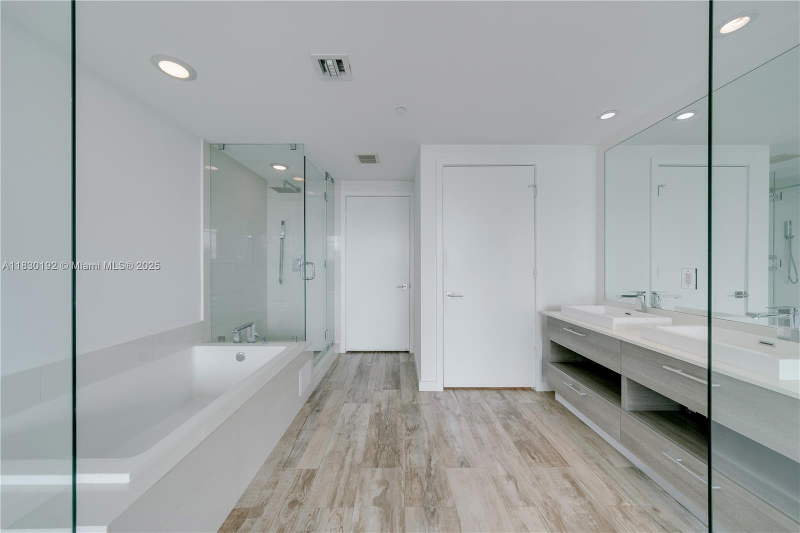 650 Northeast 32nd Street, Unit 802 Miami, FL 33137 - Photo 15 of 33 a spacious bathroom with a bathtub and a shower