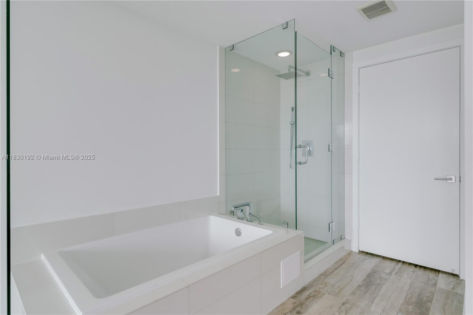 650 Northeast 32nd Street, Unit 802 Miami, FL 33137 - Photo 17 of 33 a bathroom with a tub and shower