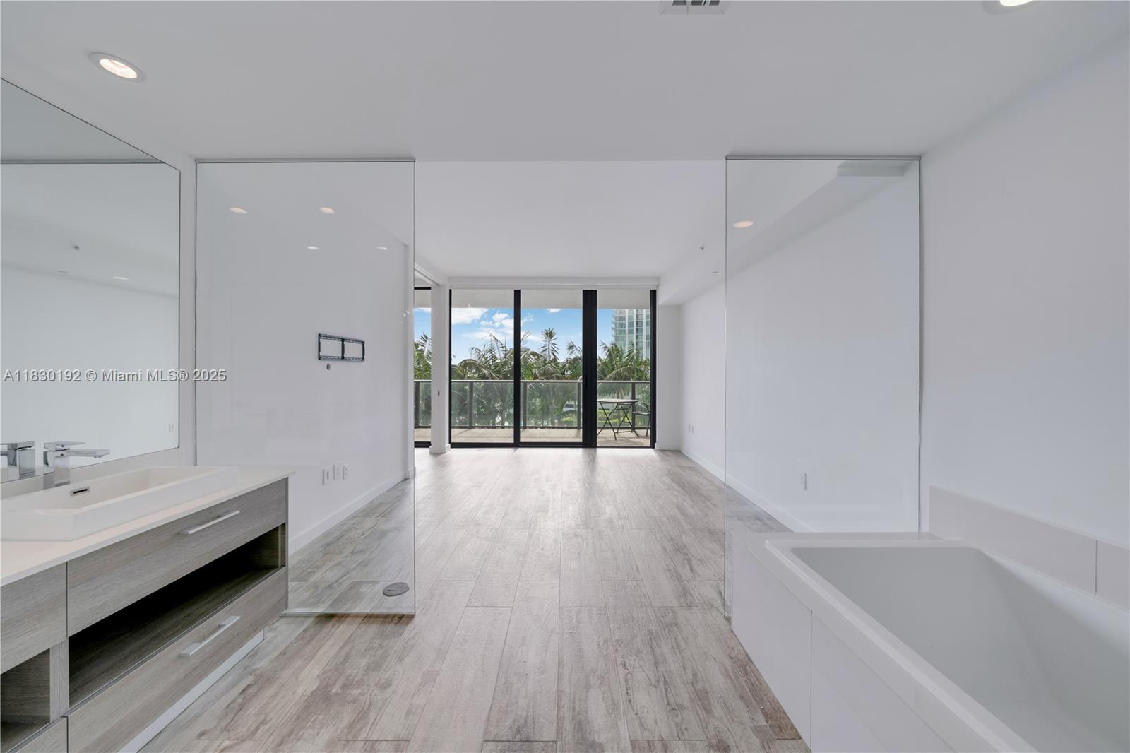 650 Northeast 32nd Street, Unit 802 Miami, FL 33137 - Photo 19 of 33 a bathroom with a bathtub and a sink