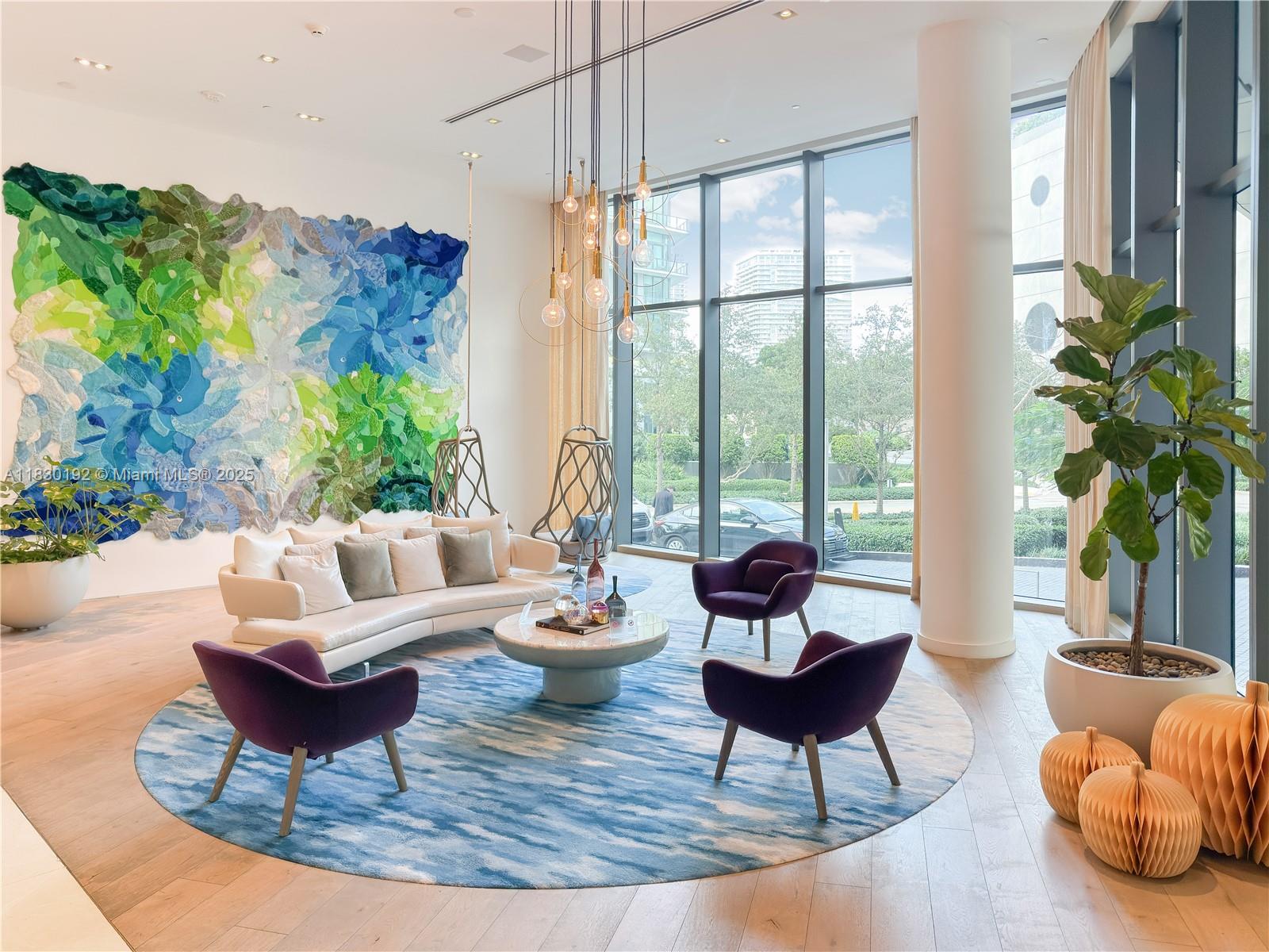 650 Northeast 32nd Street, Unit 802 Miami, FL 33137 - Photo 3 of 33 a living room with furniture and a large window