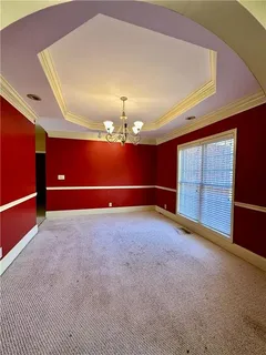 a view of room with a ceiling fan