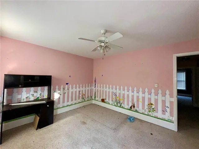 a view of room with furniture and flat screen tv