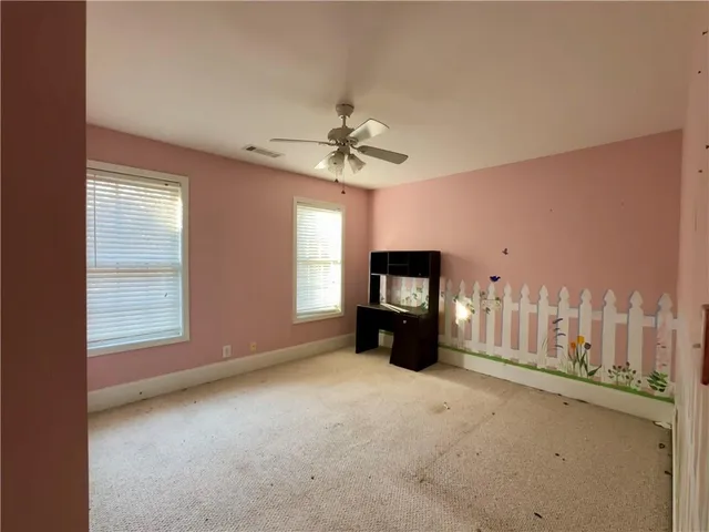 a view of a livingroom with furniture and a window