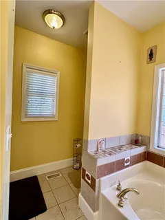 a bathroom with a tub and sink