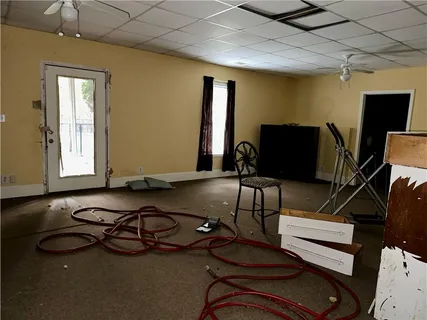 a room with gym equipment and a flat screen tv
