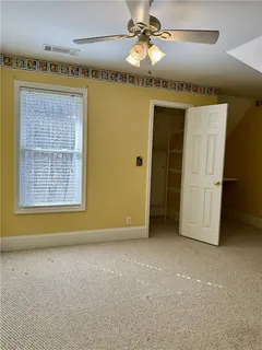 a view of a big room with windows