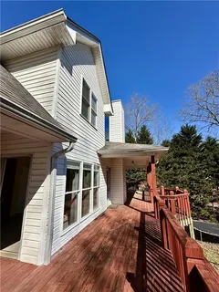a view of a yard with wooden fence