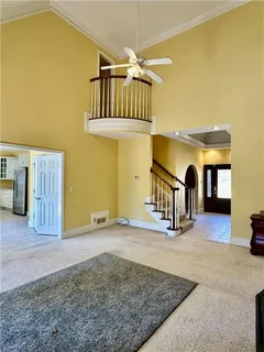 a view of a livingroom with wooden floor and toys