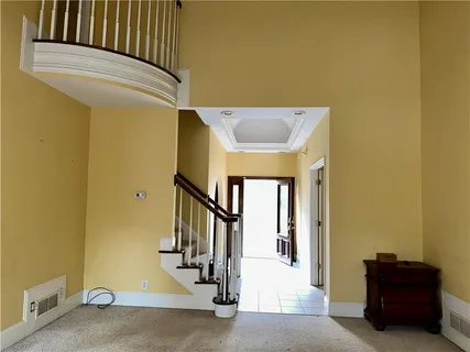 a view of a hallway with staircase