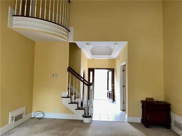 a view of a hallway with staircase