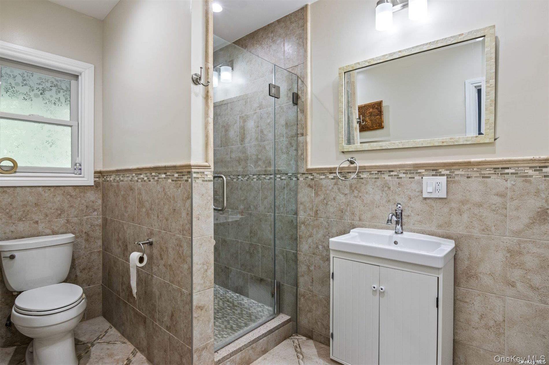 245 Main Street, Unit 1 Cold Spring Harbor, NY 11724 - Photo 15 of 27 En-Suite Bathroom w/ Washer/Dryer