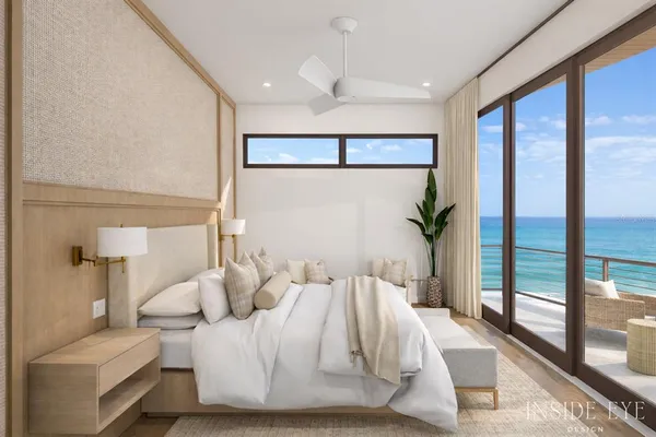 a bedroom with a large bed and a large window