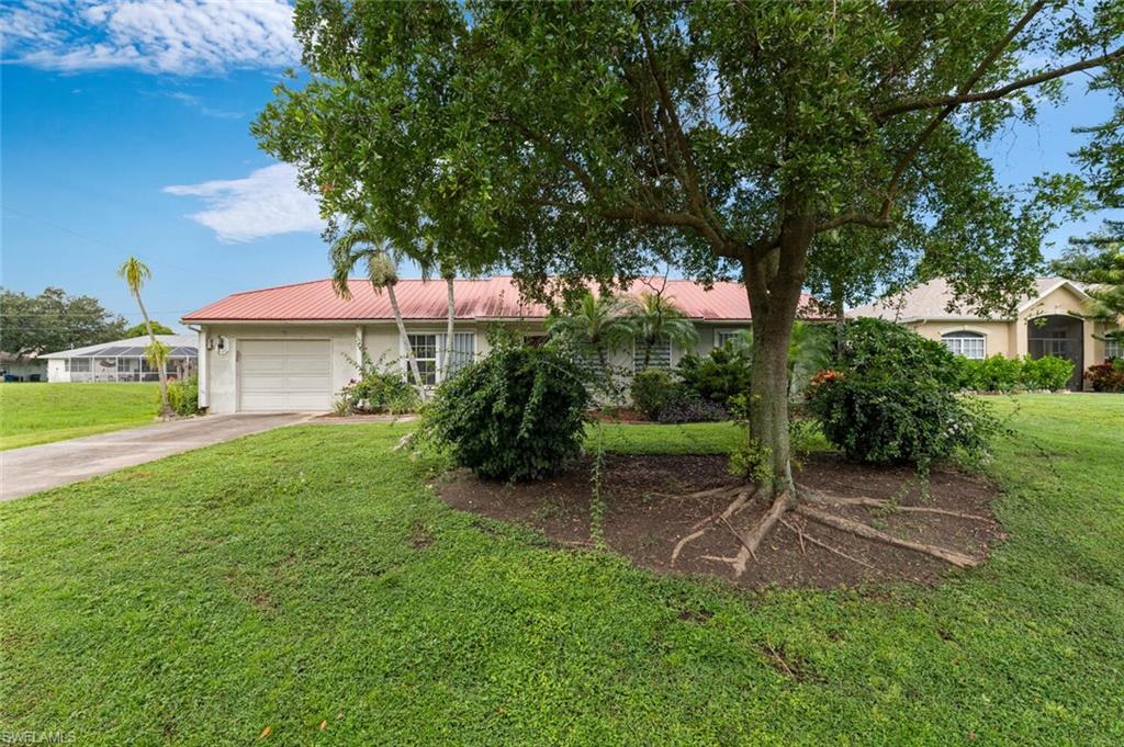 17520 Duquesne Road Fort Myers, FL 33967 - Photo 1 of 26 a view of a house with a yard and tree s