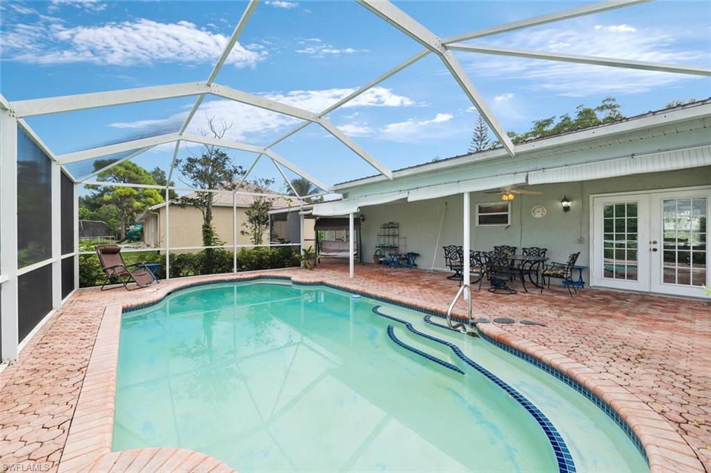 17520 Duquesne Road Fort Myers, FL 33967 - Photo 2 of 26 a view of a house with swimming pool