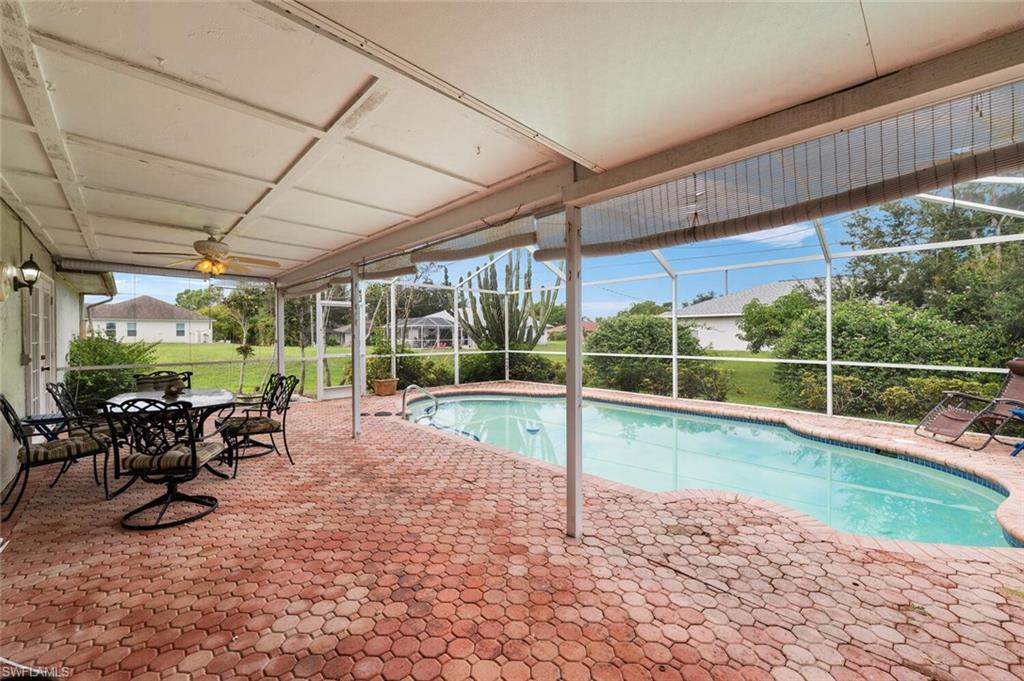 17520 Duquesne Road Fort Myers, FL 33967 - Photo 4 of 26 a view of a backyard with sitting area furniture and garden