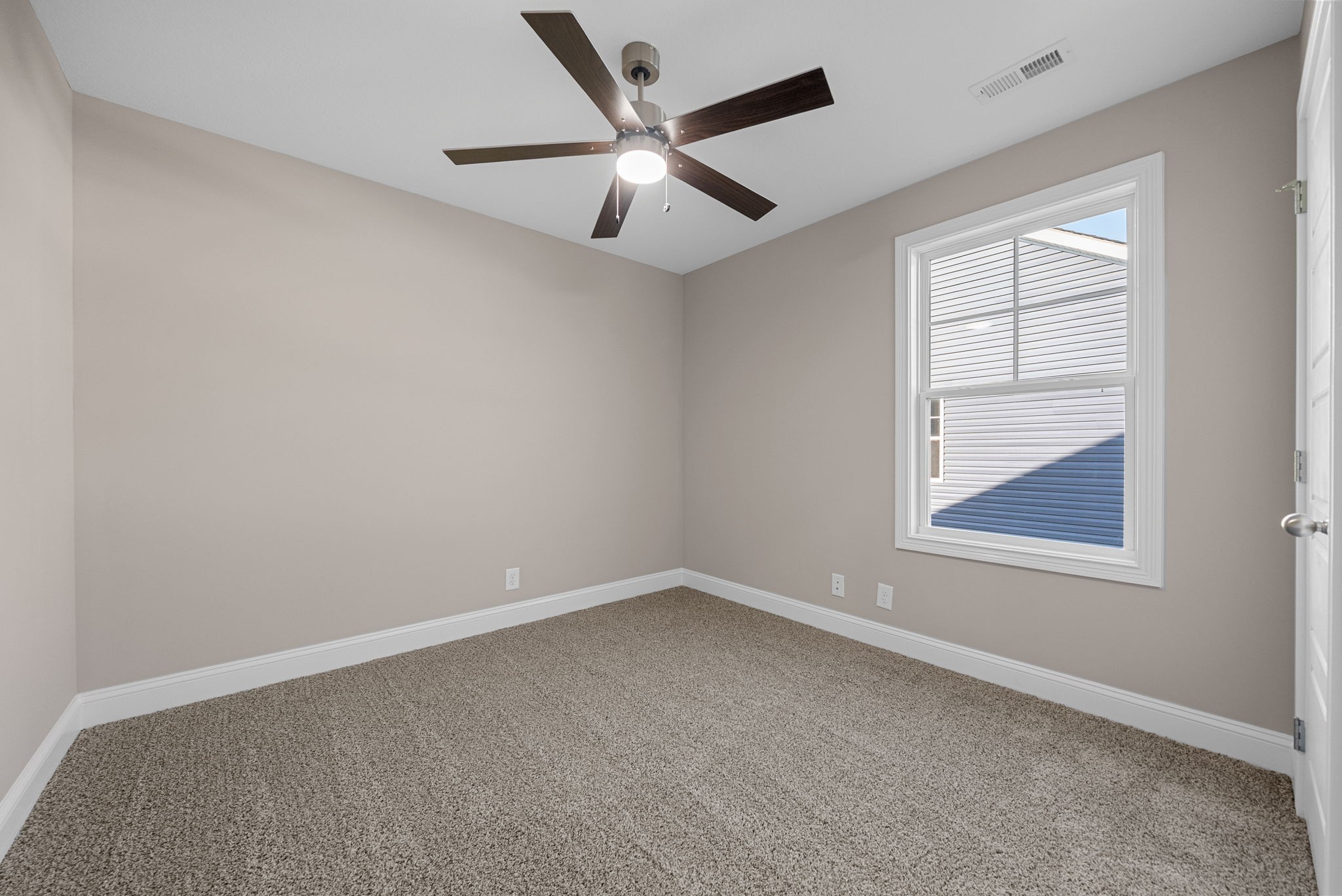 39 Echo Ridge Oak Grove, KY 42262 - Photo 22 of 28 an empty room with a window and a ceiling fan