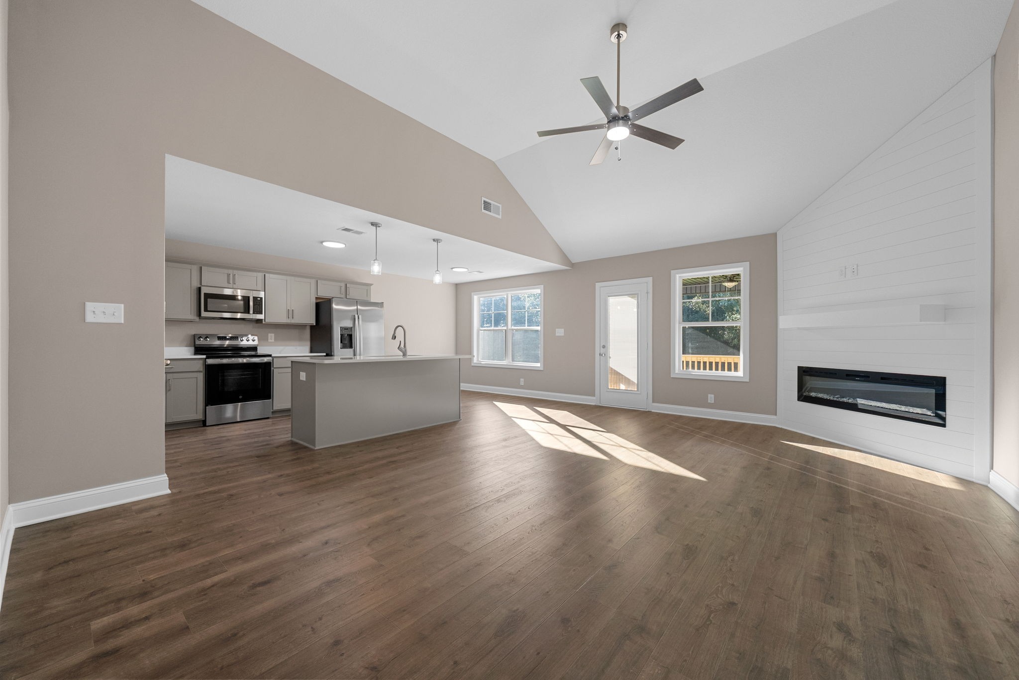 39 Echo Ridge Oak Grove, KY 42262 - Photo 5 of 28 a view of an empty room with a kitchen and wooden floor