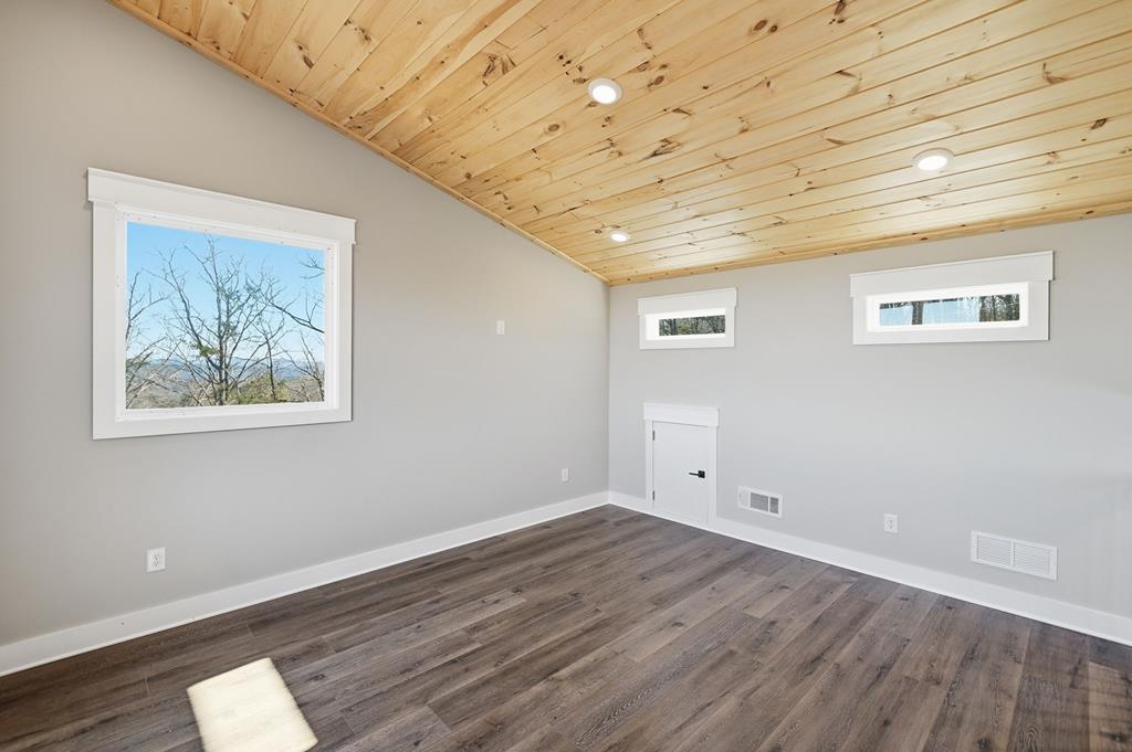 1176 Jewel Court Northeast Ranger, GA 30734 - Photo 18 of 57 a view of empty room with wooden floor